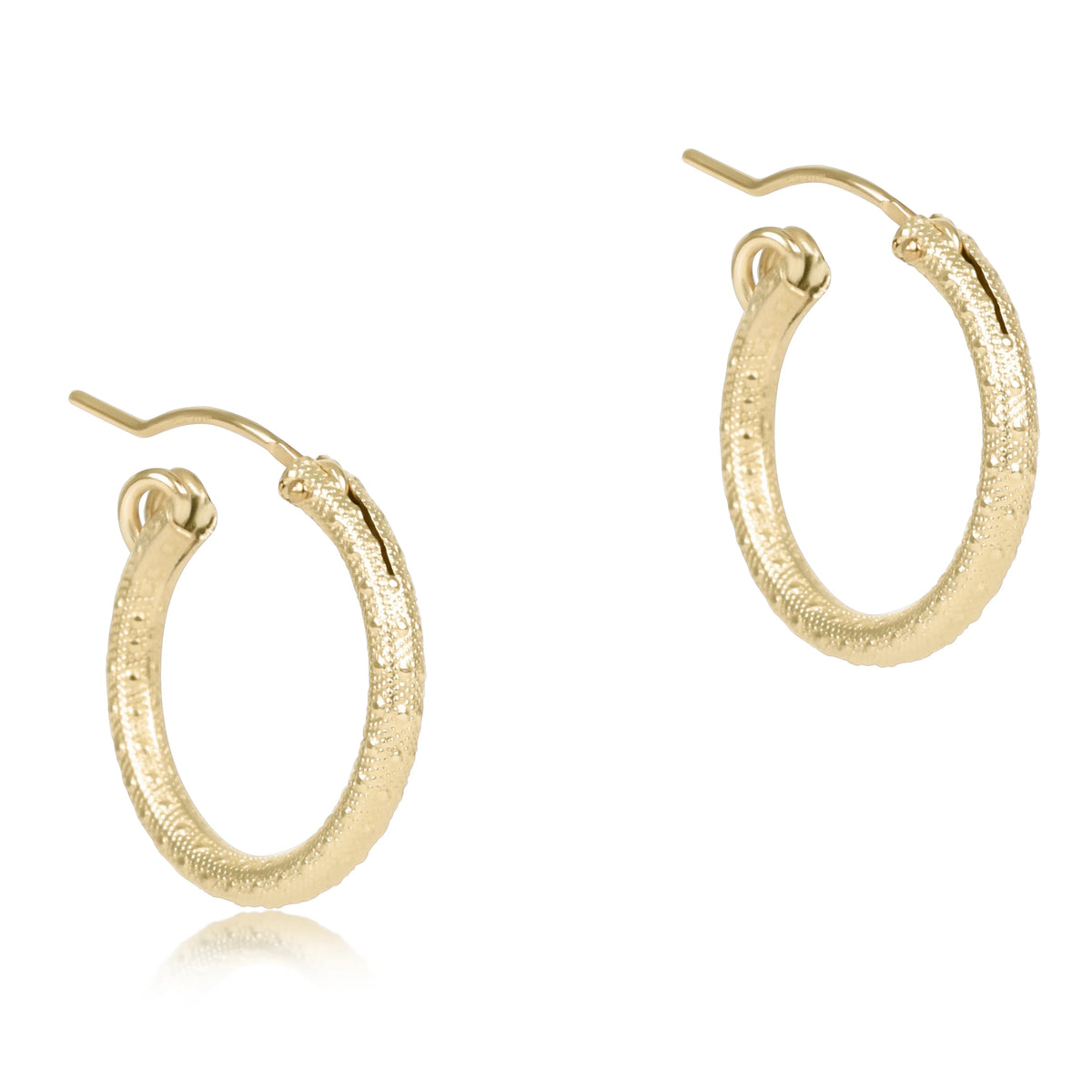 round gold textured hoop earrings on a white background