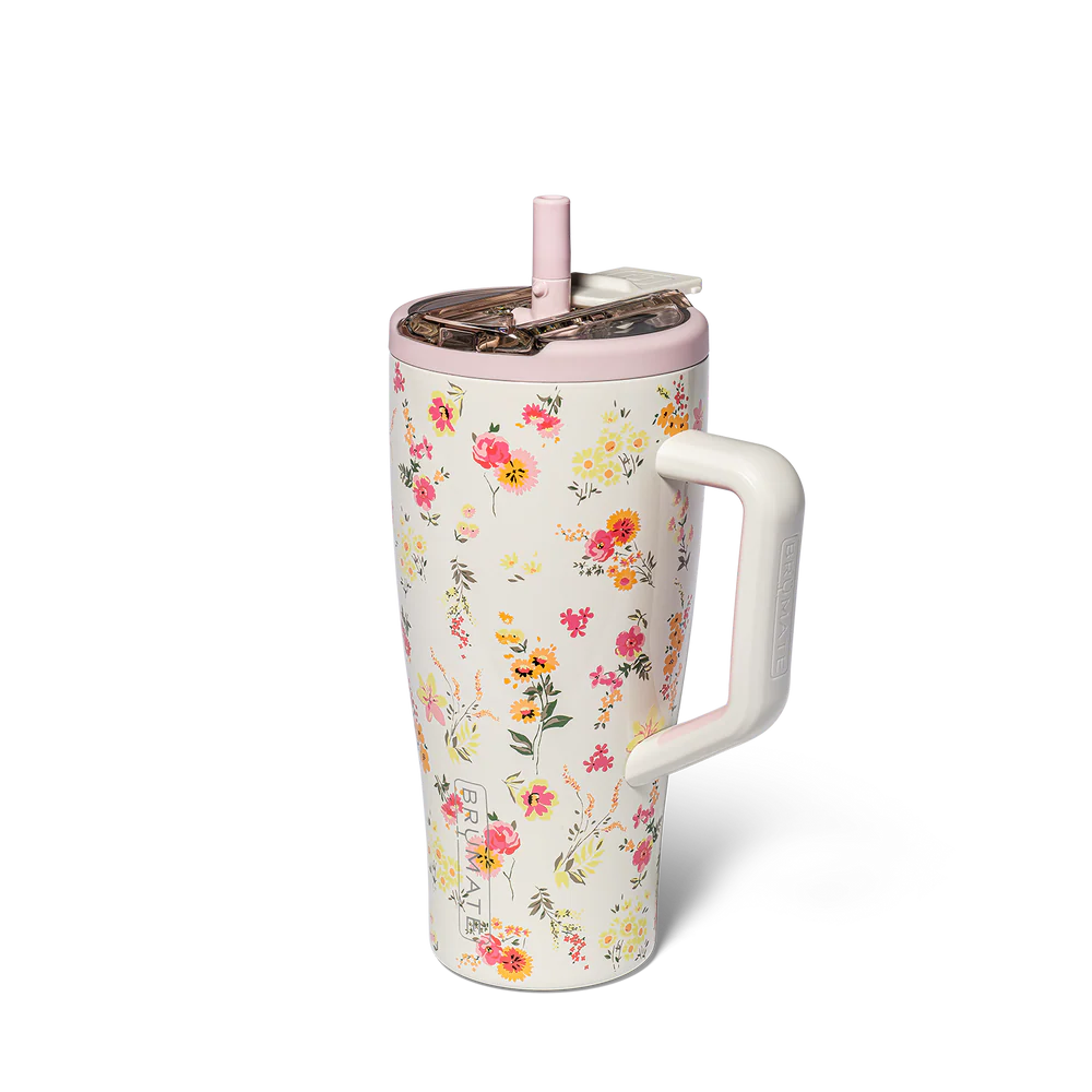 cream colored insolated tumbler with handle and straw covered in a pink and yellow floral design
