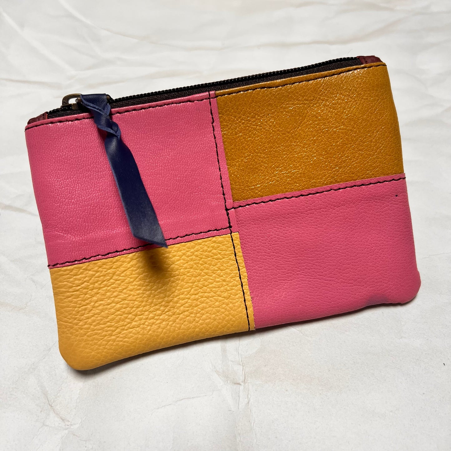 zahra pouch with pink and yellow patchwork.