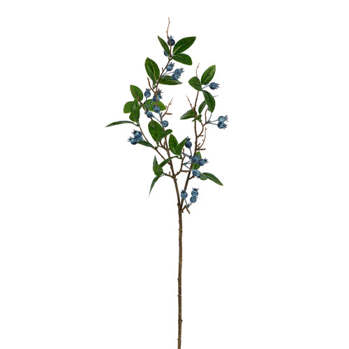 Artificial blueberry spray with green leaves and blue berries on a long stem shown on a white background.
