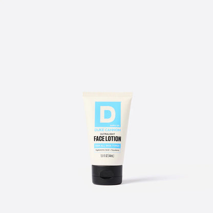 Tube of face lotion with a blue 'D' logo on a white background