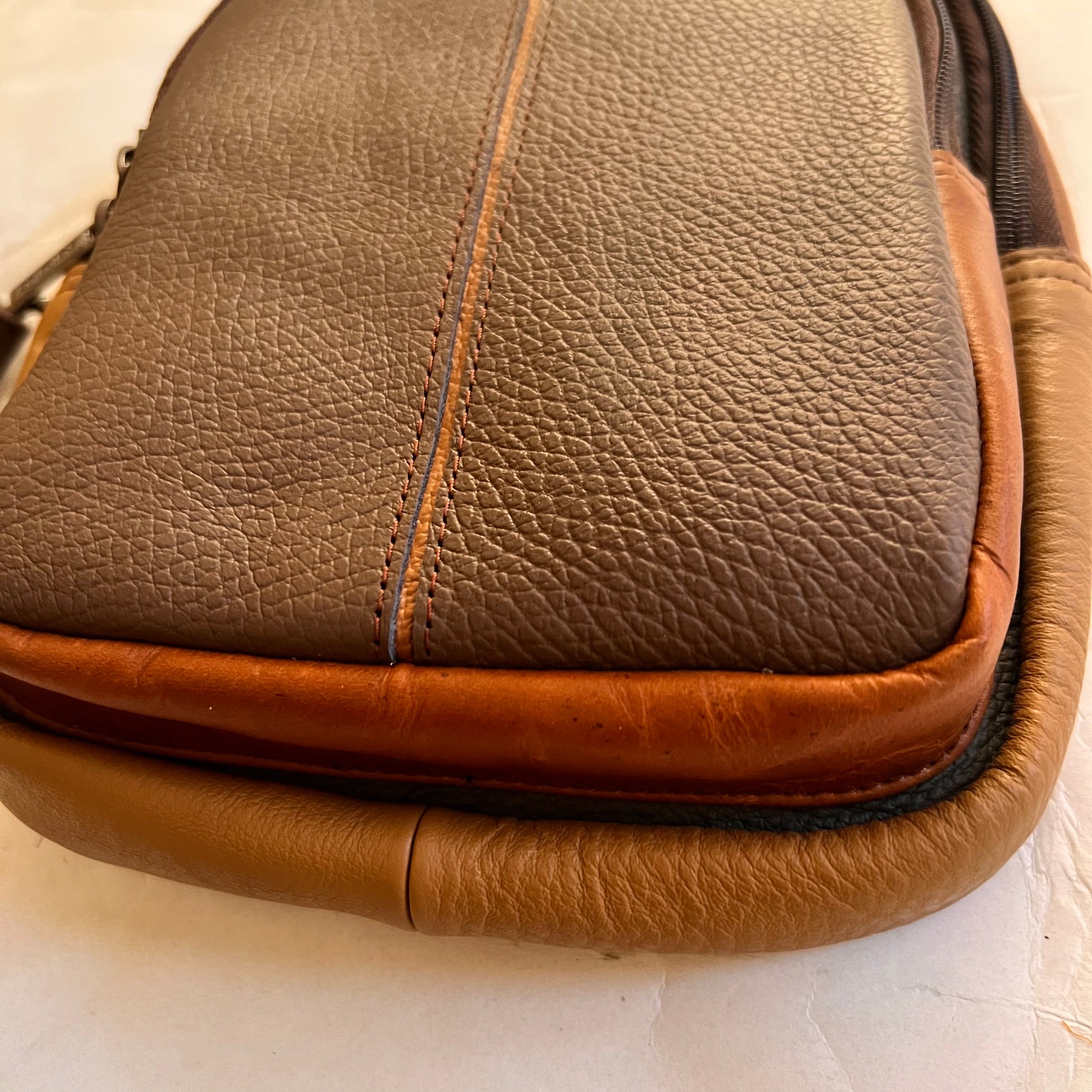 close-up of bottom of mushroom Gregg sling bag.