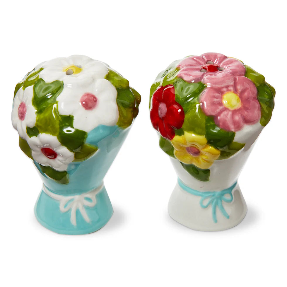 Floral-themed salt and pepper shakers on a white background