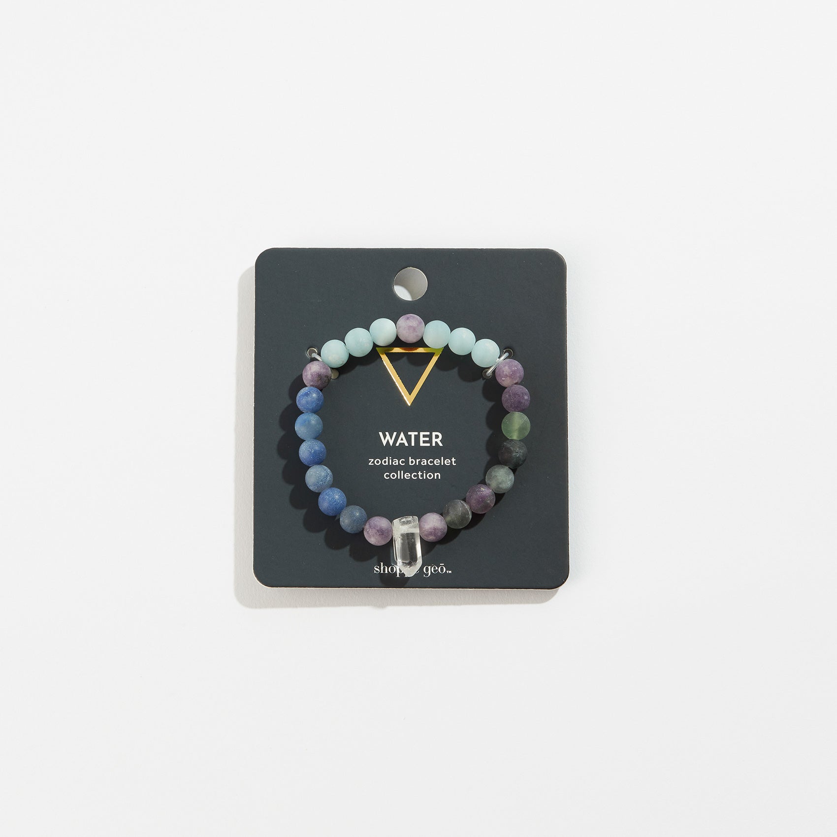 stone bead bracelet with crystal on its card packaging.