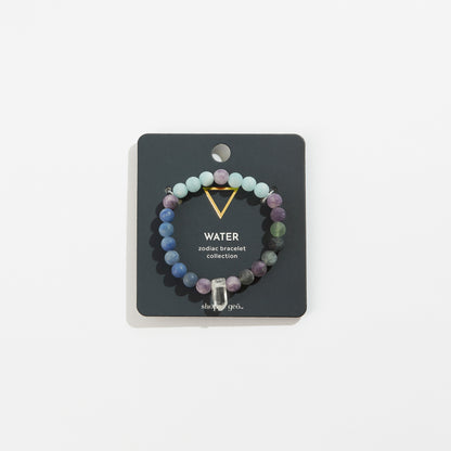 stone bead bracelet with crystal on its card packaging.