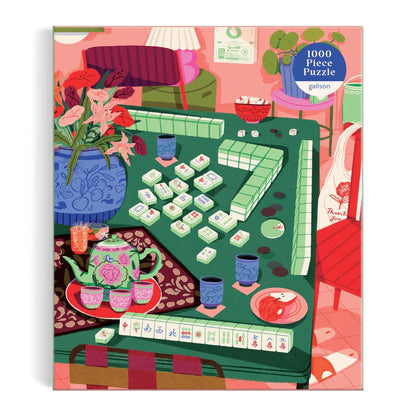 Puzzle box with a colorful illustration of a tea party scene and mahjong game.