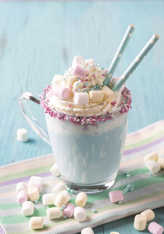 glass mug filled with blue yeti hot chocolate and topped with marshmallows and spinkles.