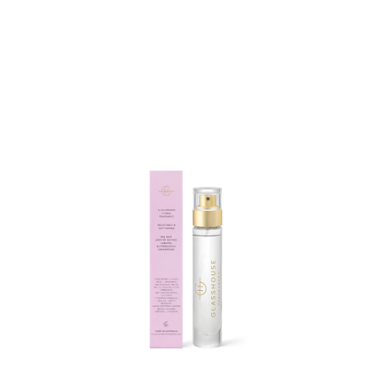 glass bottle of A Tahaa Affair Eau De Parfum set next to the back view of its pink box packaging