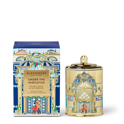 Under The Mistletoe Candle set next to its box packaging shown on a white background