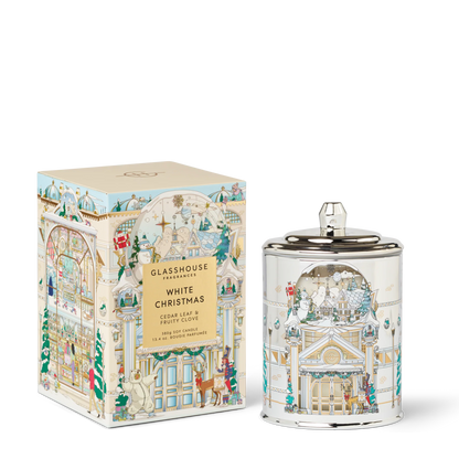 White Christmas Candle set next to a side view of its box packaging