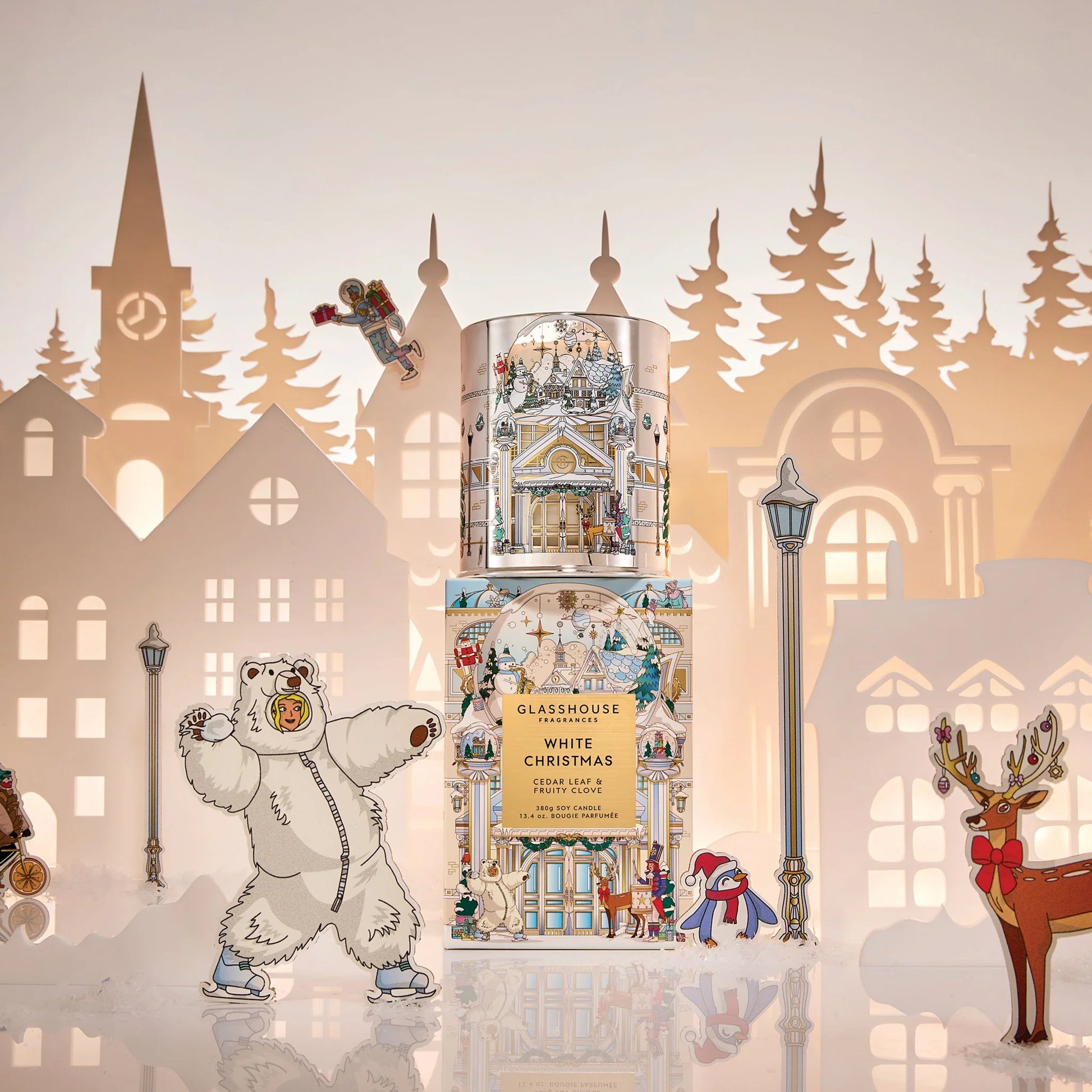 White Christmas Candle set on its box packaging in front of a city skyline background