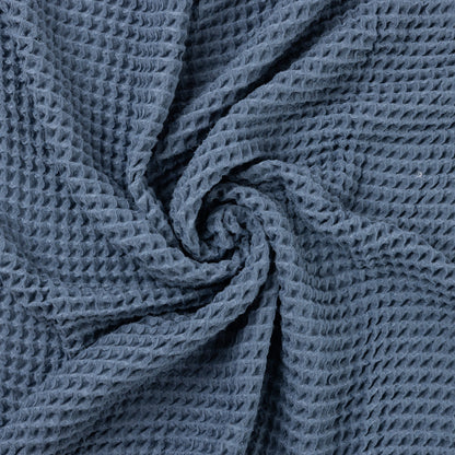 rain blanket folded in a swirling pattern.