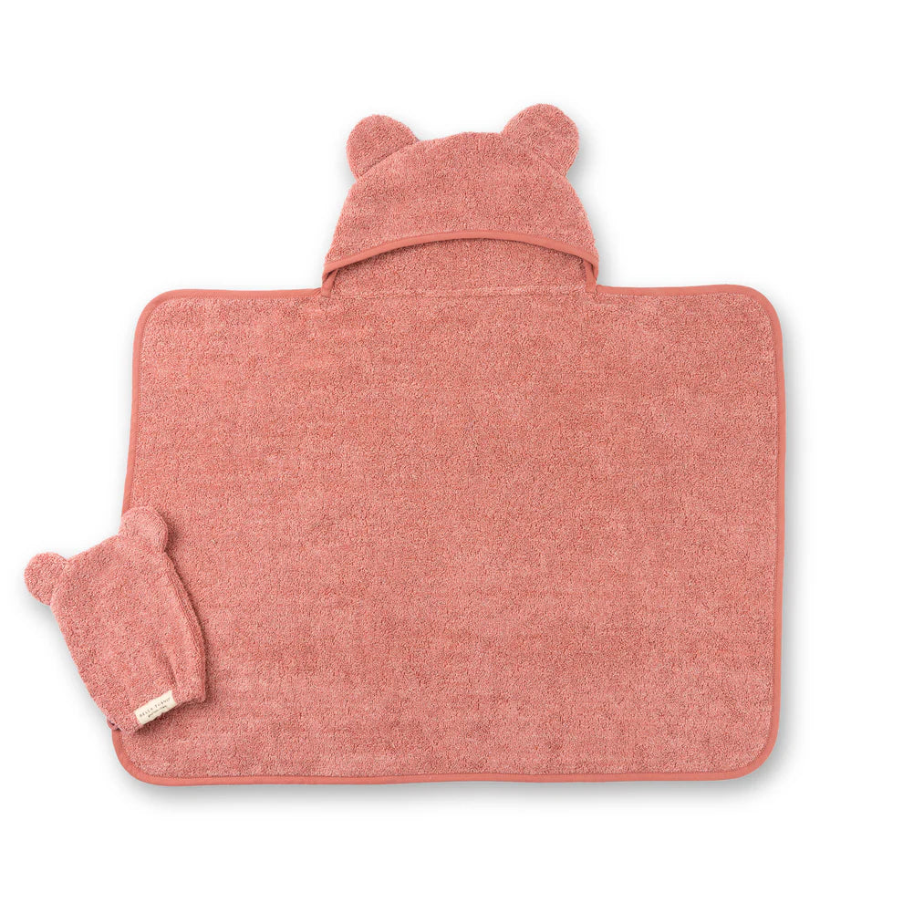 watermelon towel laying flat with mitt set on it.