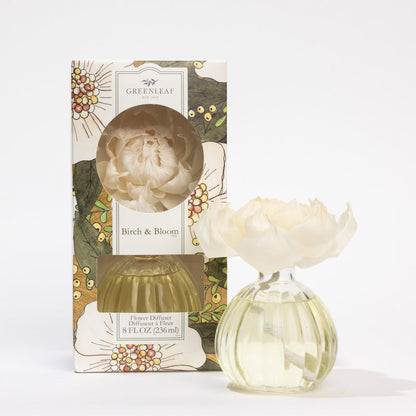 front view of Birch & Bloom Flower Diffuser in its box packaging and a diffuser set next to it