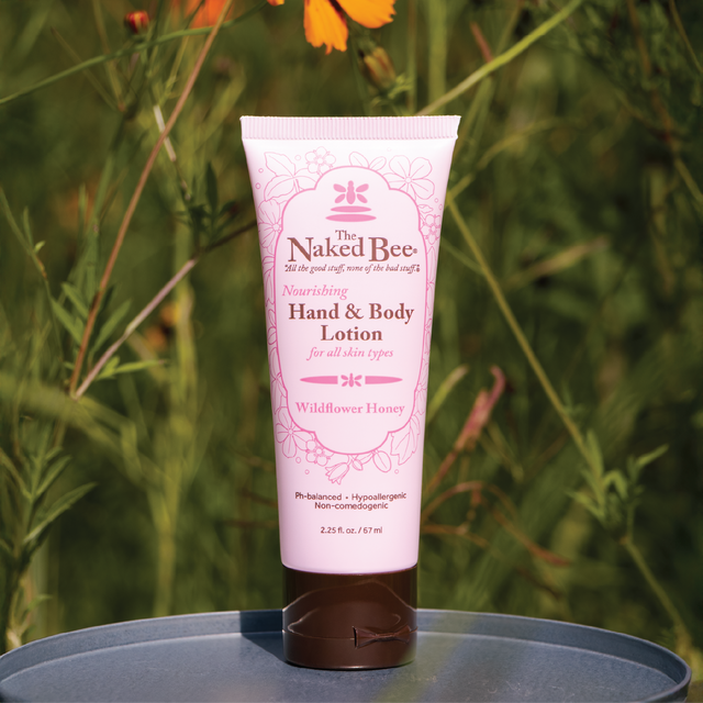 wildflower hand and body lotion set in front of a meadow