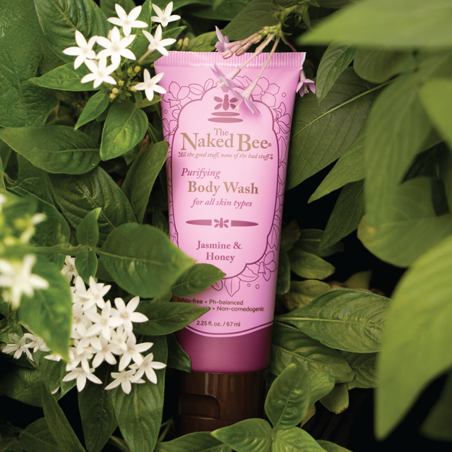 tube of Jasmine & Honey body wash set with a jasmine plant