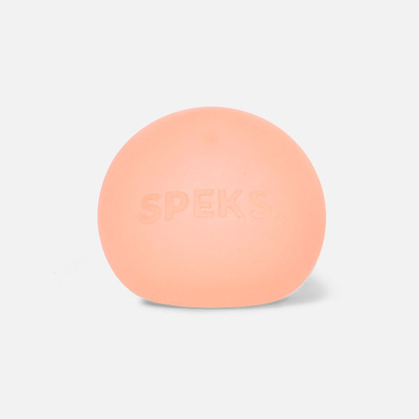 pale orange stress ball with the brand name 'Speks' embossed on it.