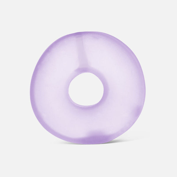 Purple donut-shaped stress ball on a white background