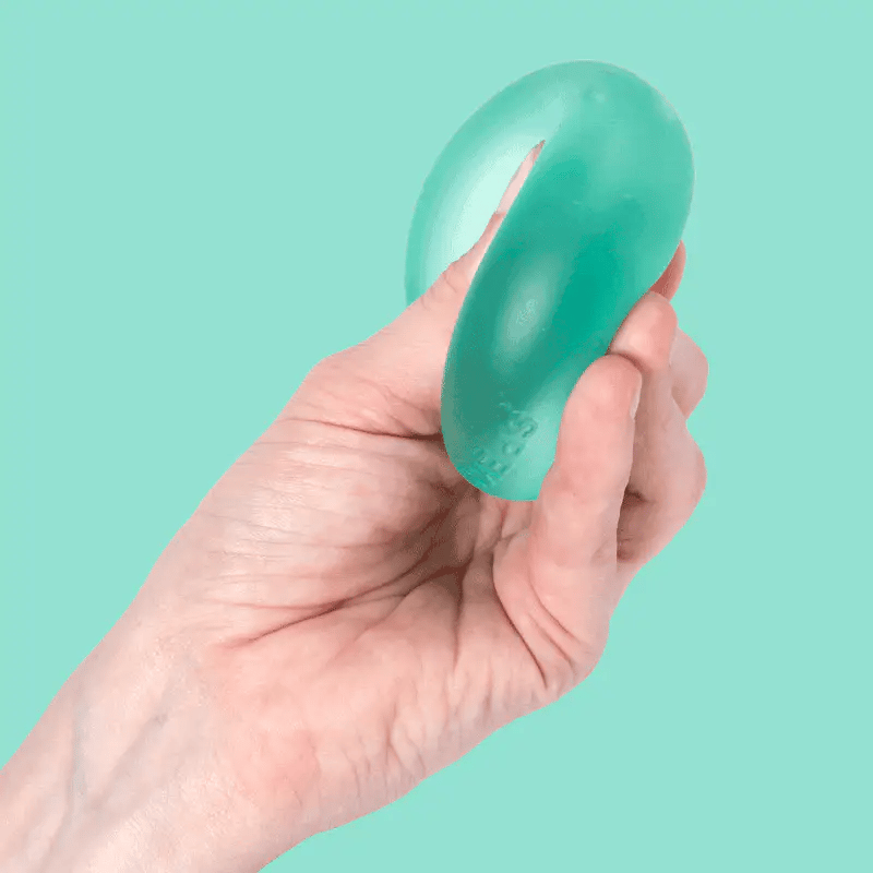 hand squeezing green stress ball