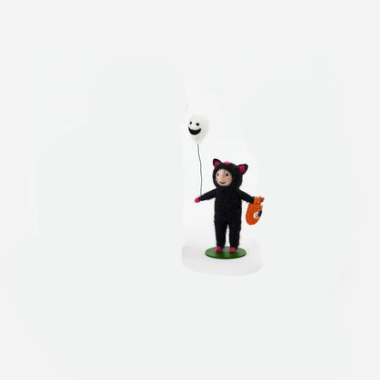 small felt figurine a child dressed in black cat costume holding a white ghost balloon
