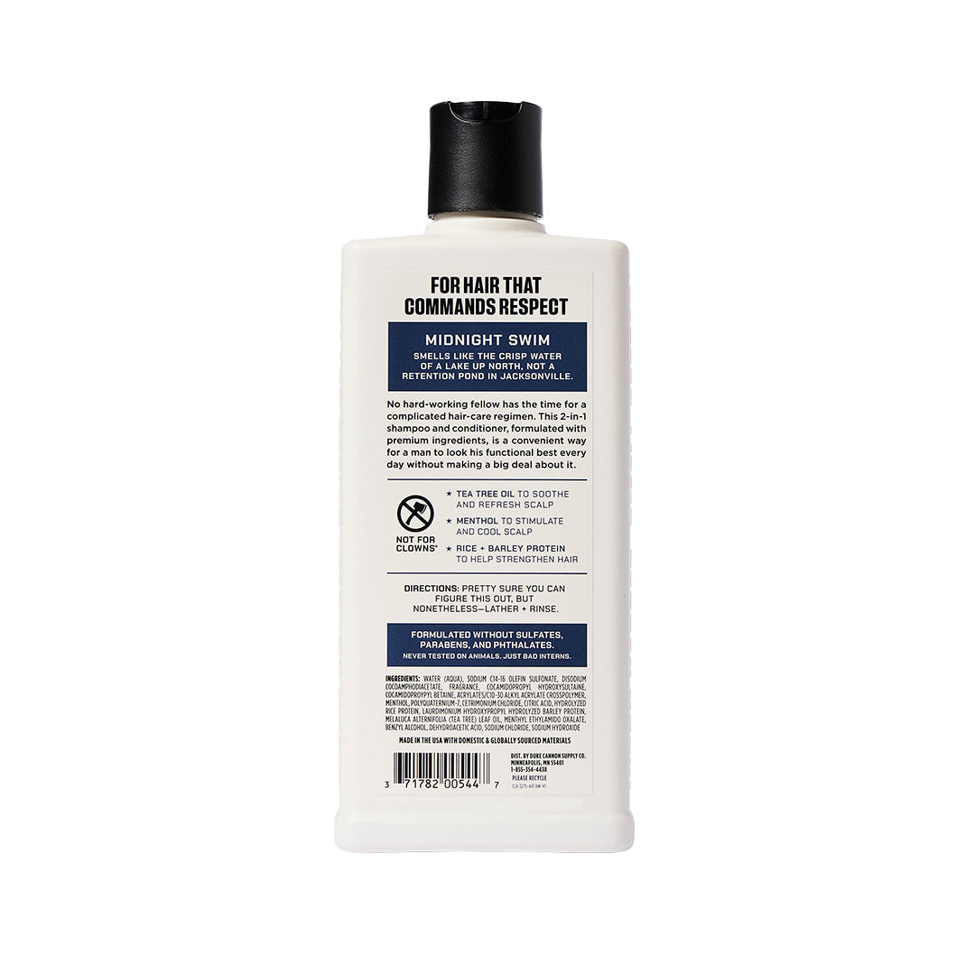 back side view of a bottle of midnight swim shampoo+ conditioner on a white background 