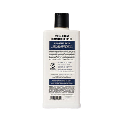 back side view of a bottle of midnight swim shampoo+ conditioner on a white background 