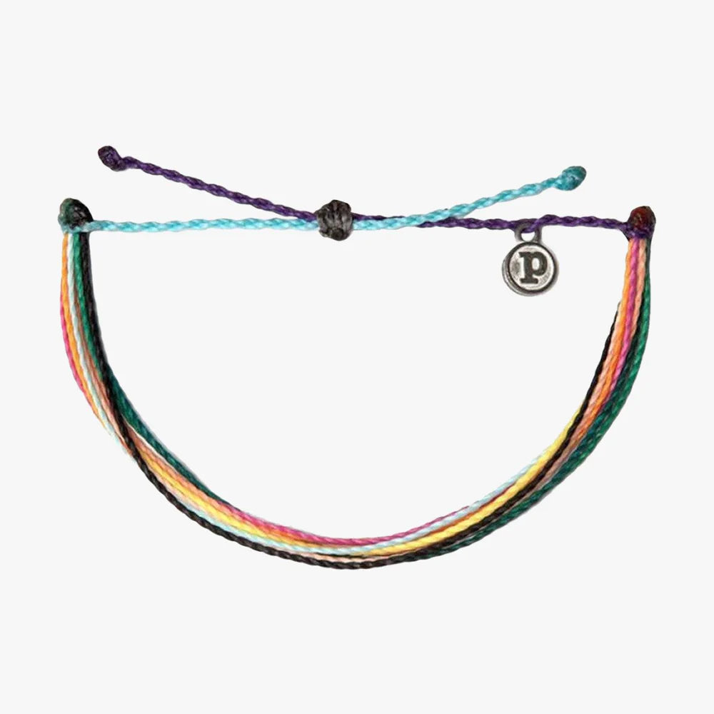 Pura Vida multi strand corded bracelet in varying shades of red, orange, yellow, green, blue, purple, white, and black with a Pura Vida logo charm