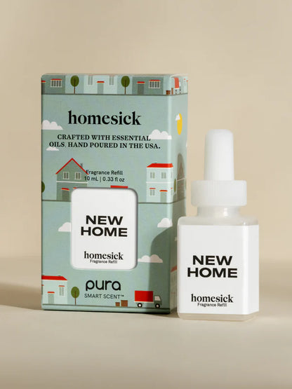 vial of new home fragrance set next to its box packaging.