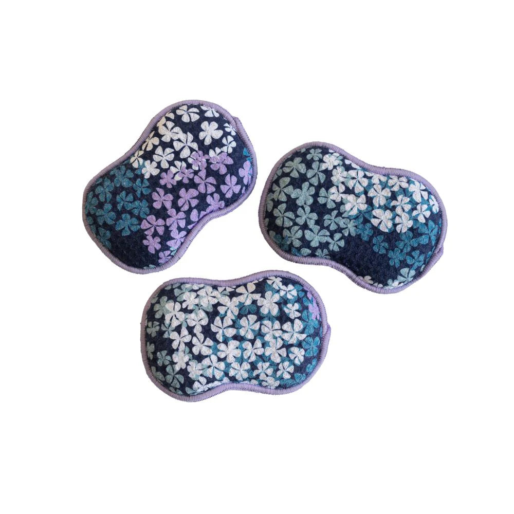 3 blue reusable sponges with blue, white, and purple hydrangea patterns arranged on a white background.