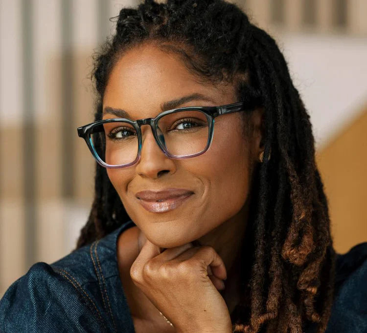 person wearing the  blue/purple latte glasses frame