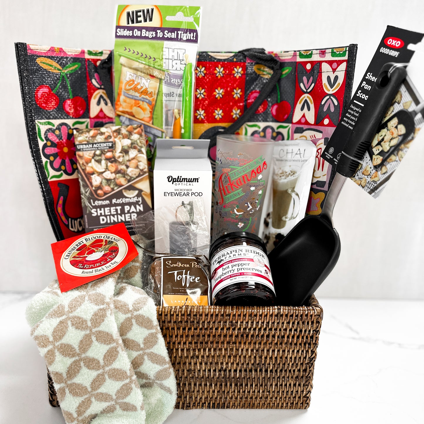 ten favorite things items in a basket with tote bag propped behind on a white background
