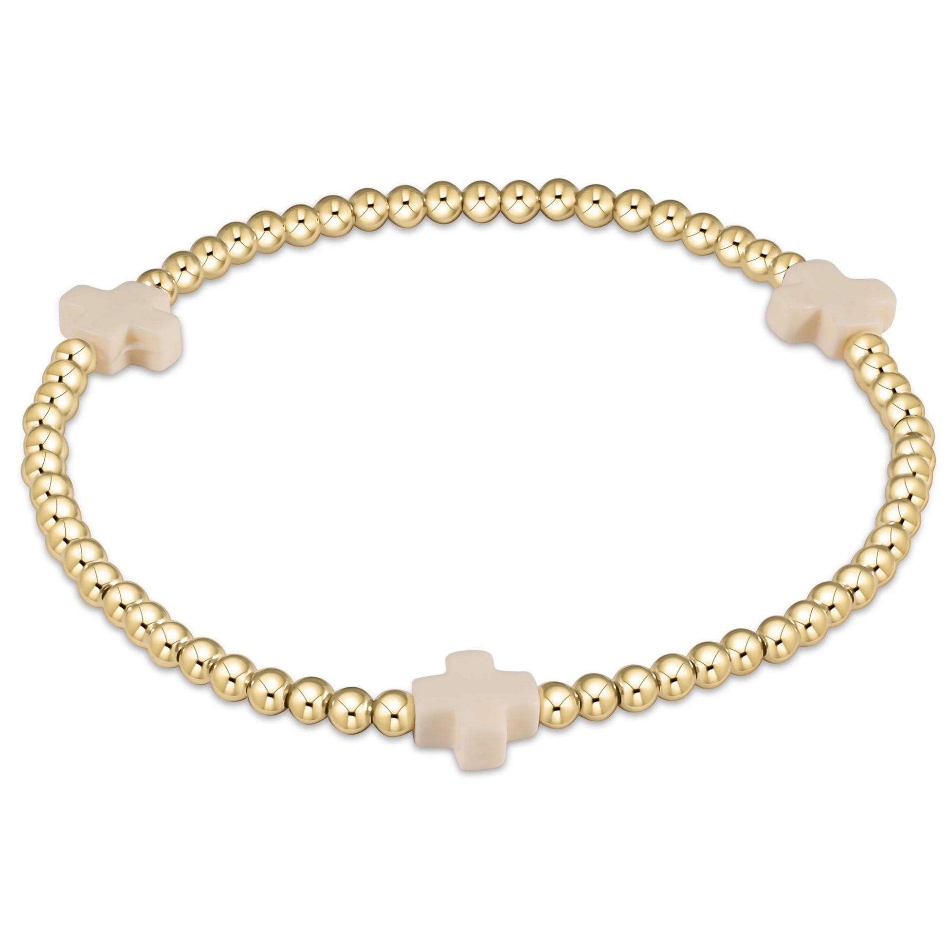 extends signature cross 3mm gold bracelet in off white on a white  background