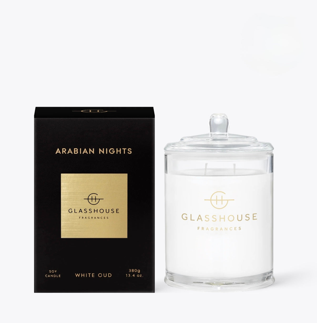 Arabian nights candle set next to its black box packaging.