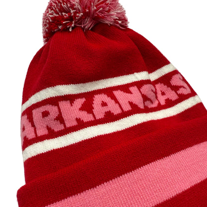 close-up of Red  beanie with pink and white stripes and 'ARKANSAS' text in pink on a white background