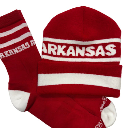 Red and white socks and beanie with 'ARKANSAS' text on them