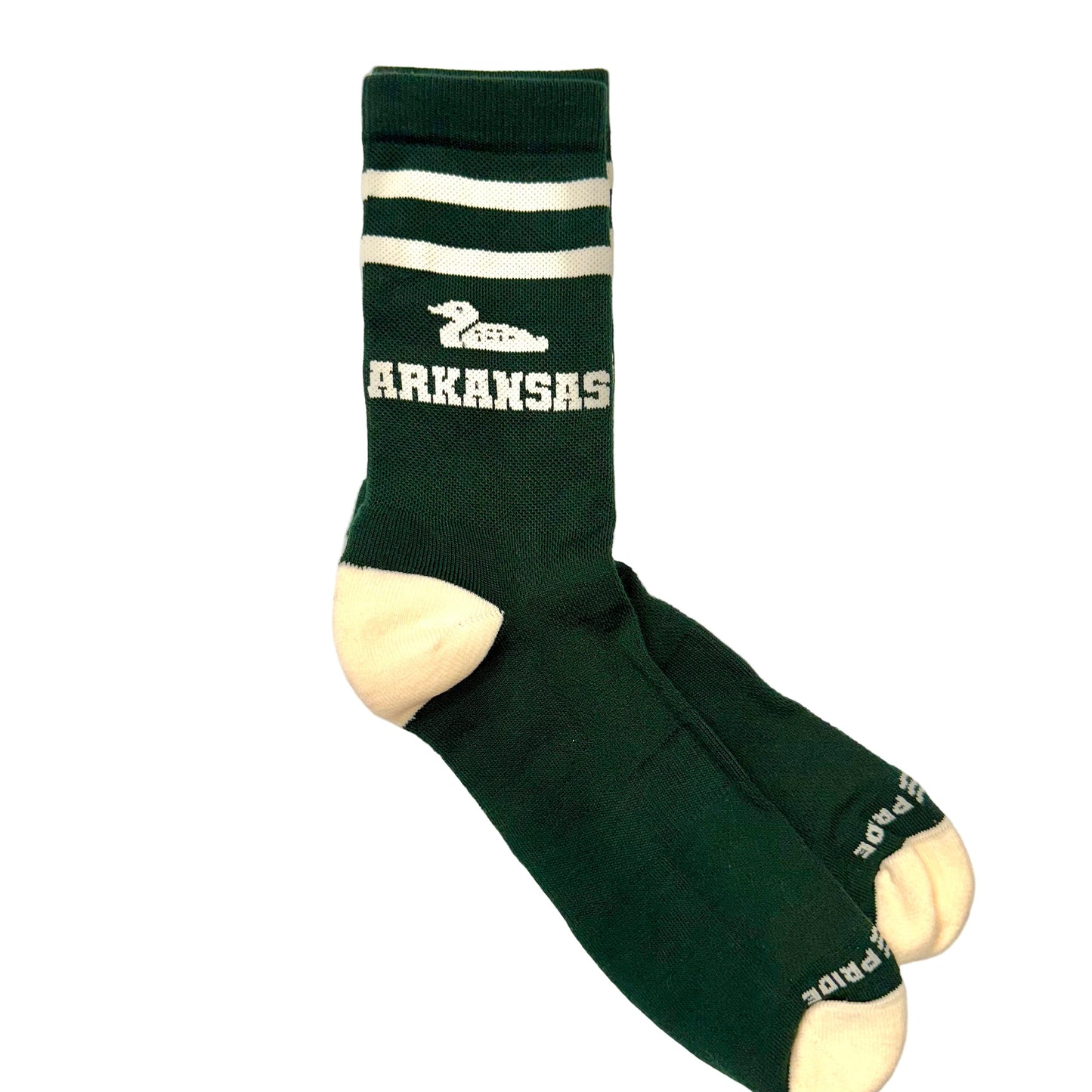 Green socks with a duck and 'ARKANSAS' text on a marble surface