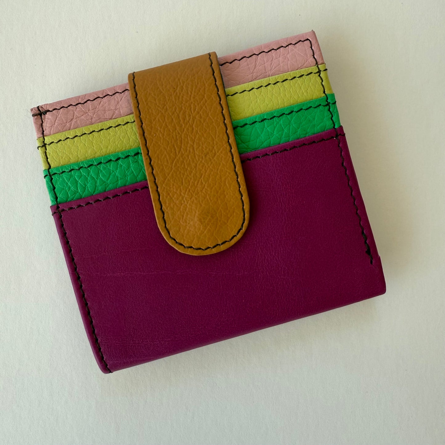 fuchsia wallet with colorful card slots