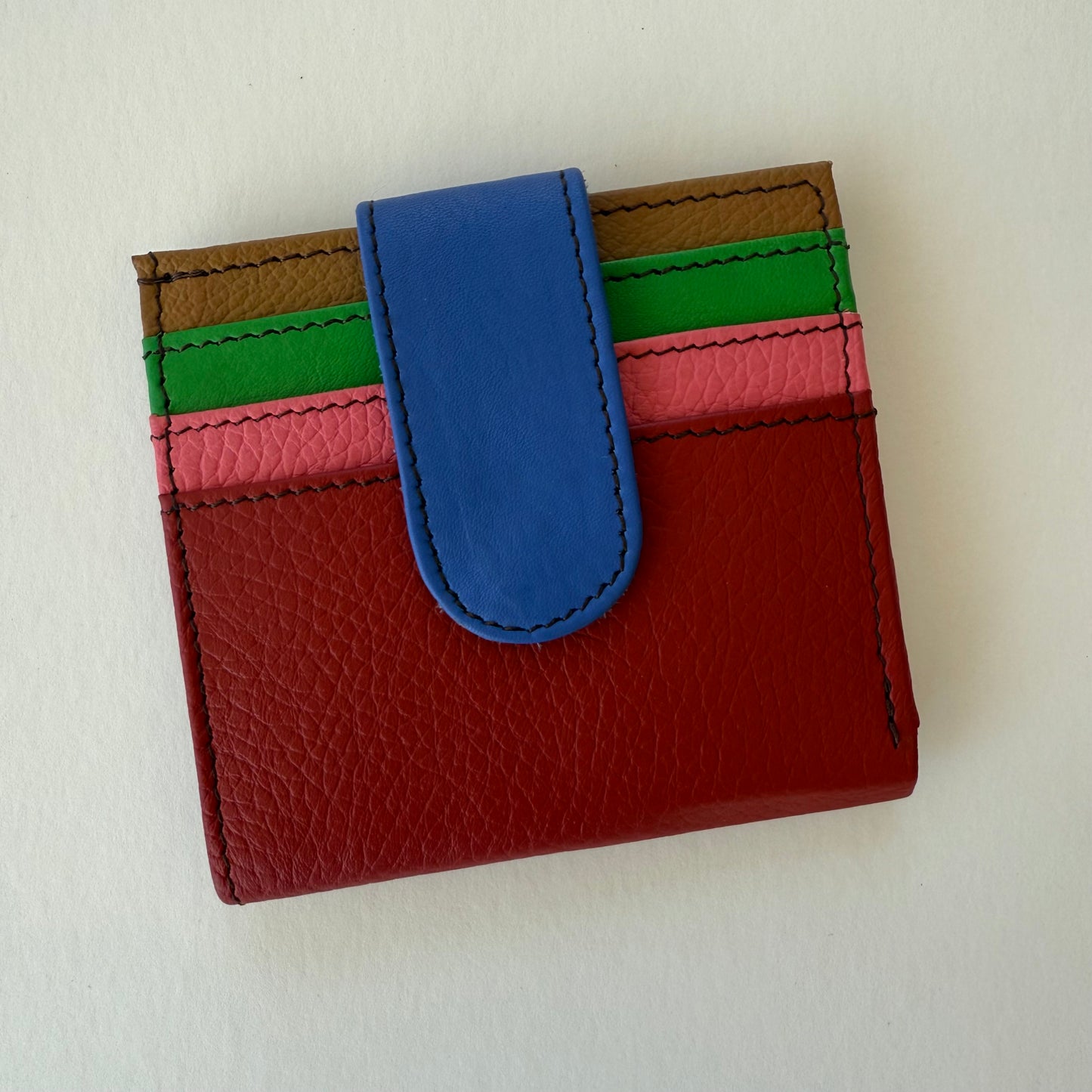 cranberry colored wallet with colorful card slots
