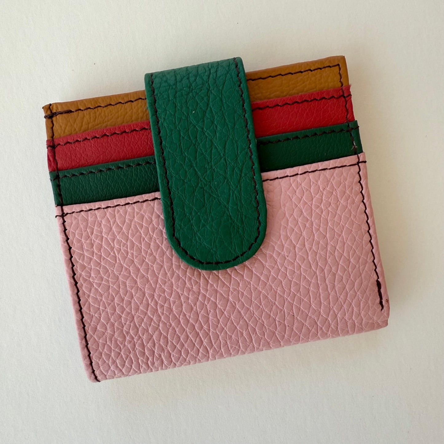 carnation pink colored wallet with colorful card slots