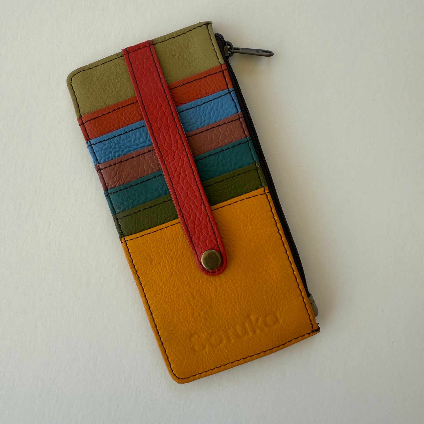Colorful striped wallet with a strap to secure cards