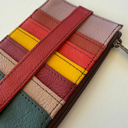 close-up of Multicolored leather wallet with a zipper on a light background