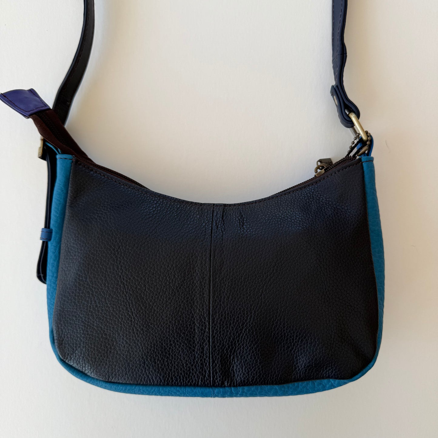 back view of handbag with dark blue backing