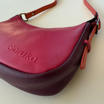 side view of pink leather handbag