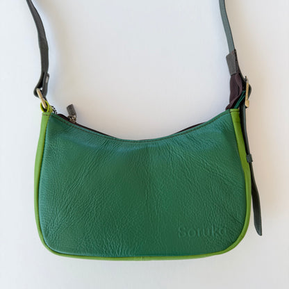 bright green leather handbag shown on a white background