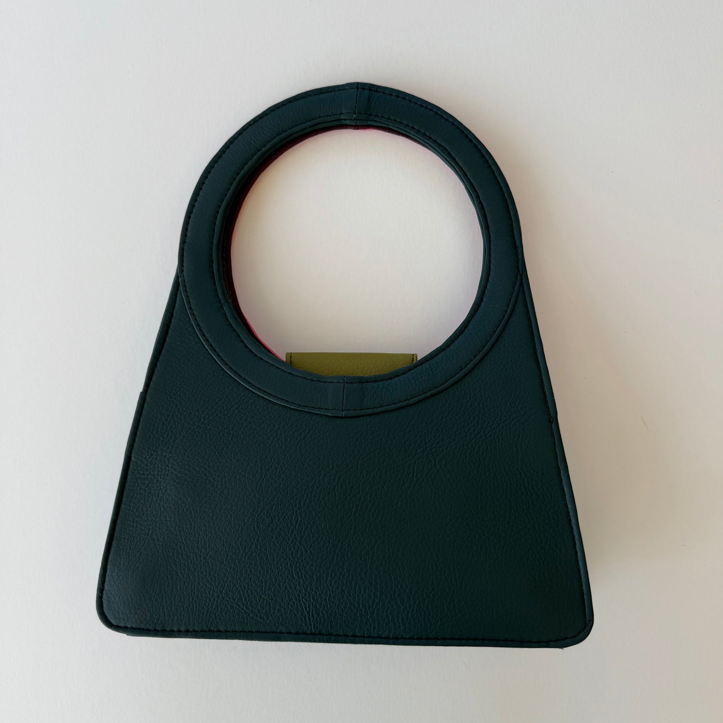 back view of honey handbag in deep teal hue