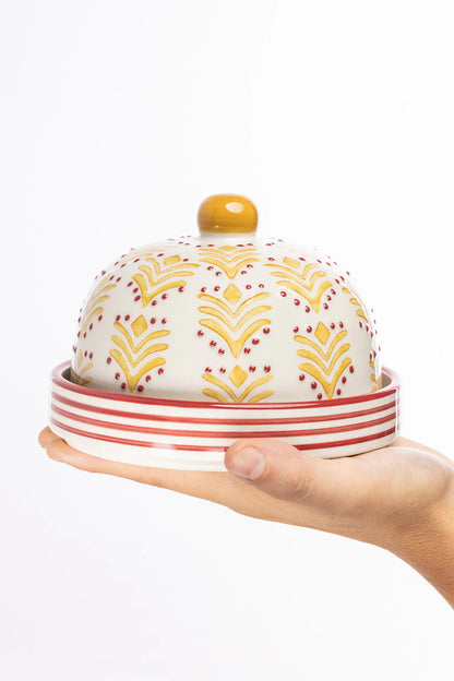 hand holding Art Deco Cheese Bell