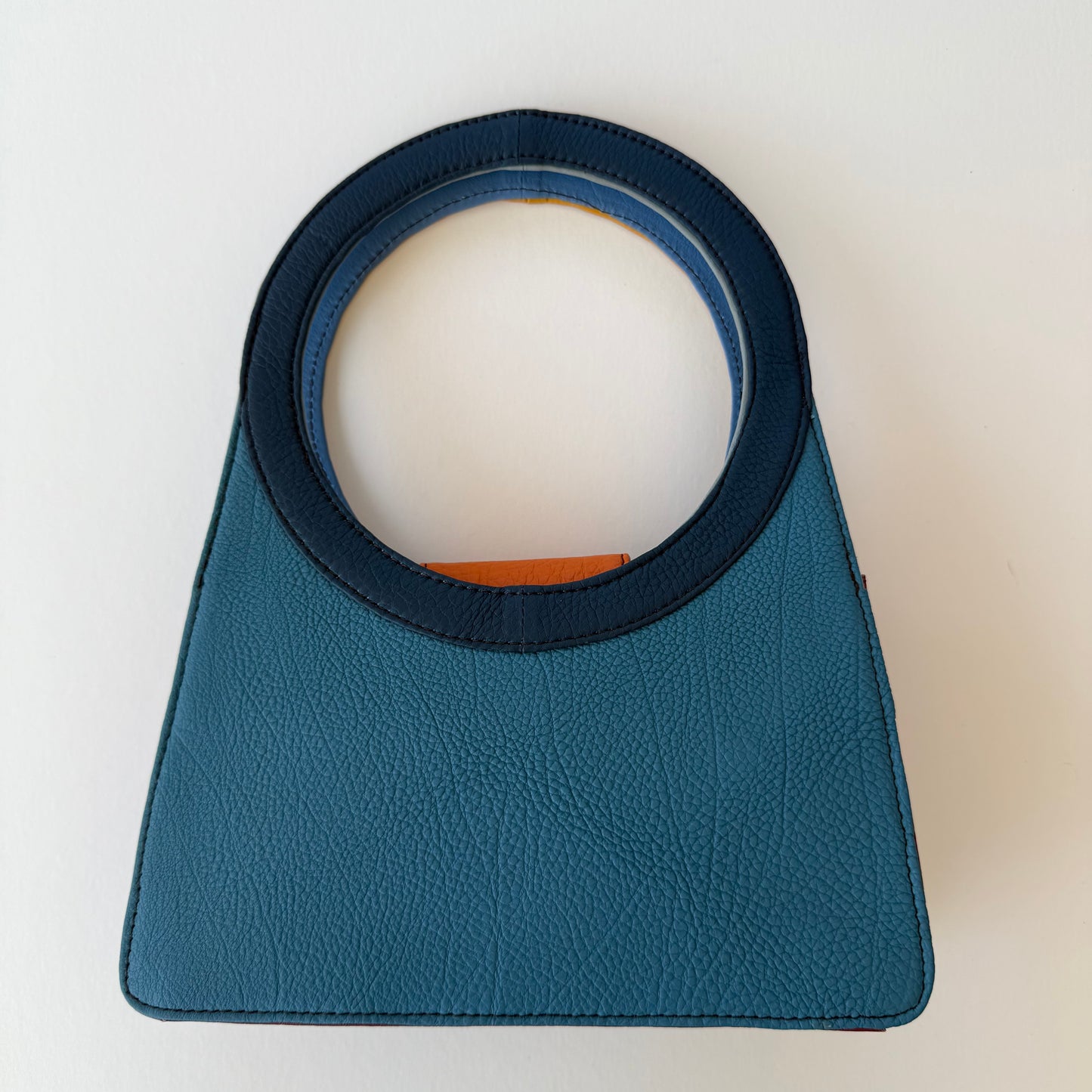 back view of handbag with blue hues