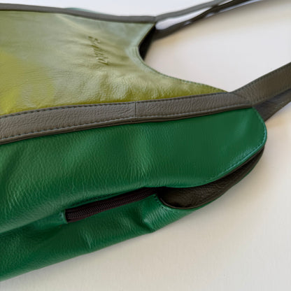 side view of green leather shoulder bag