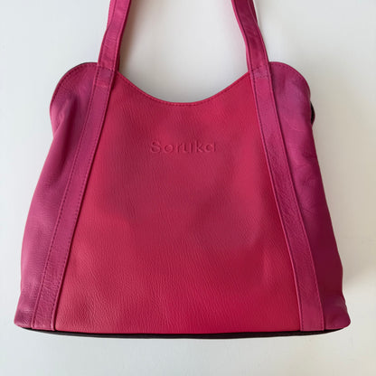 pink leather shoulder bag shown on a white background