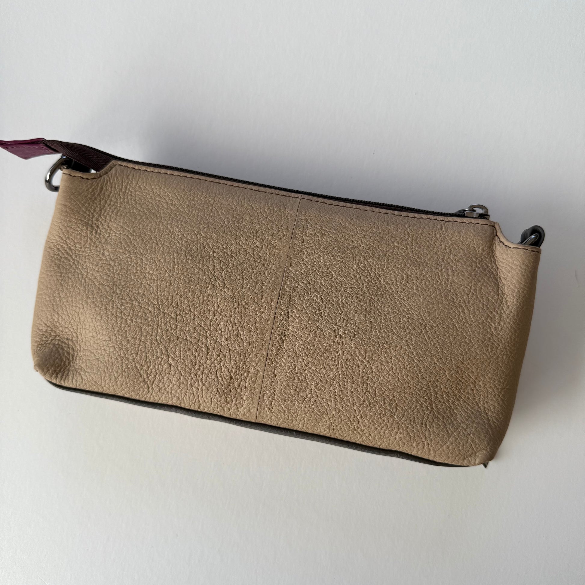 back view of turquoise madison crossbody with taupe back